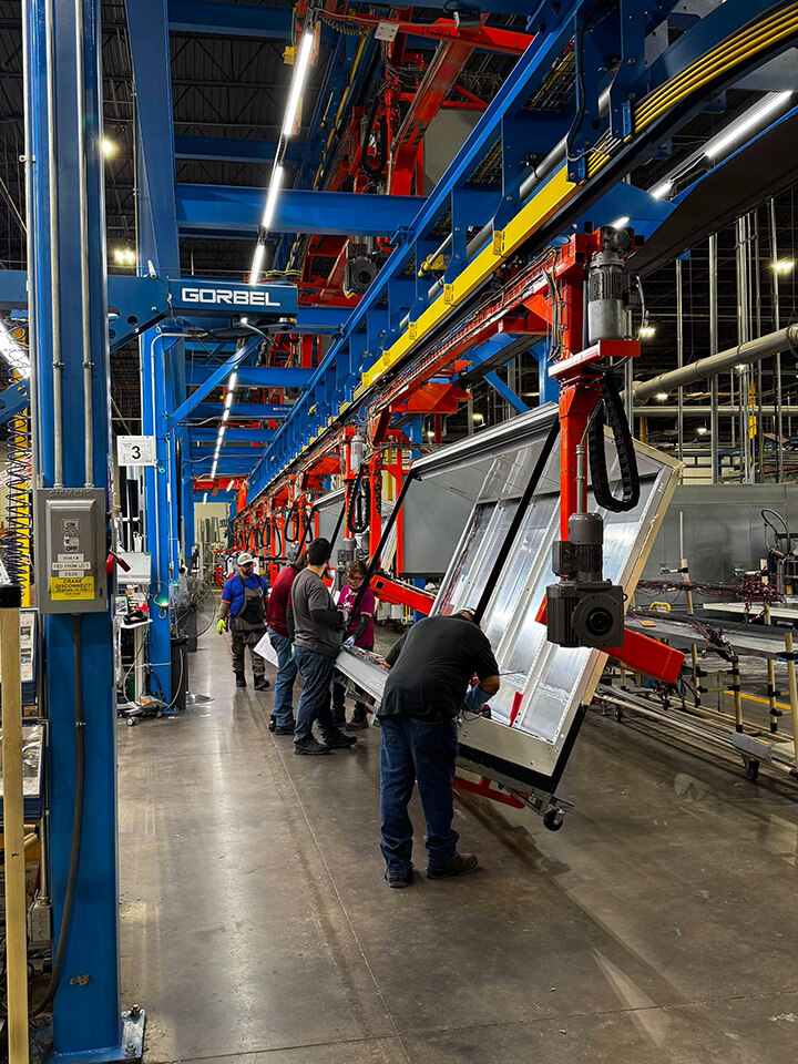 img_automated-line Workers on an automated line in a factory